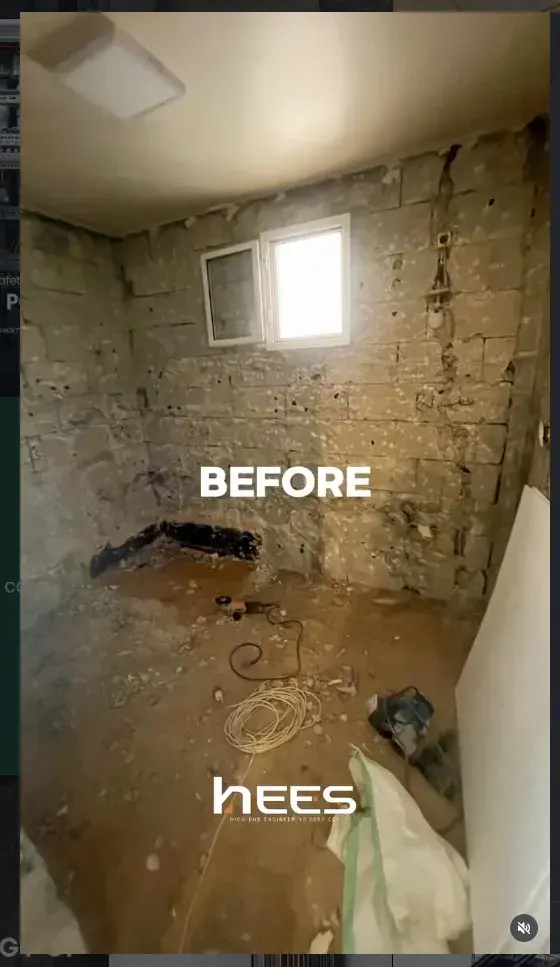 Bathroom stripped back to bare block walls before rebuilding