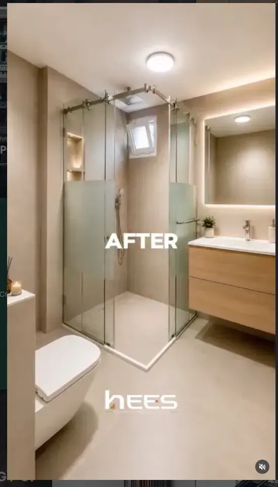 Finished bathroom with a frameless glass shower, backlit mirror and oak vanity